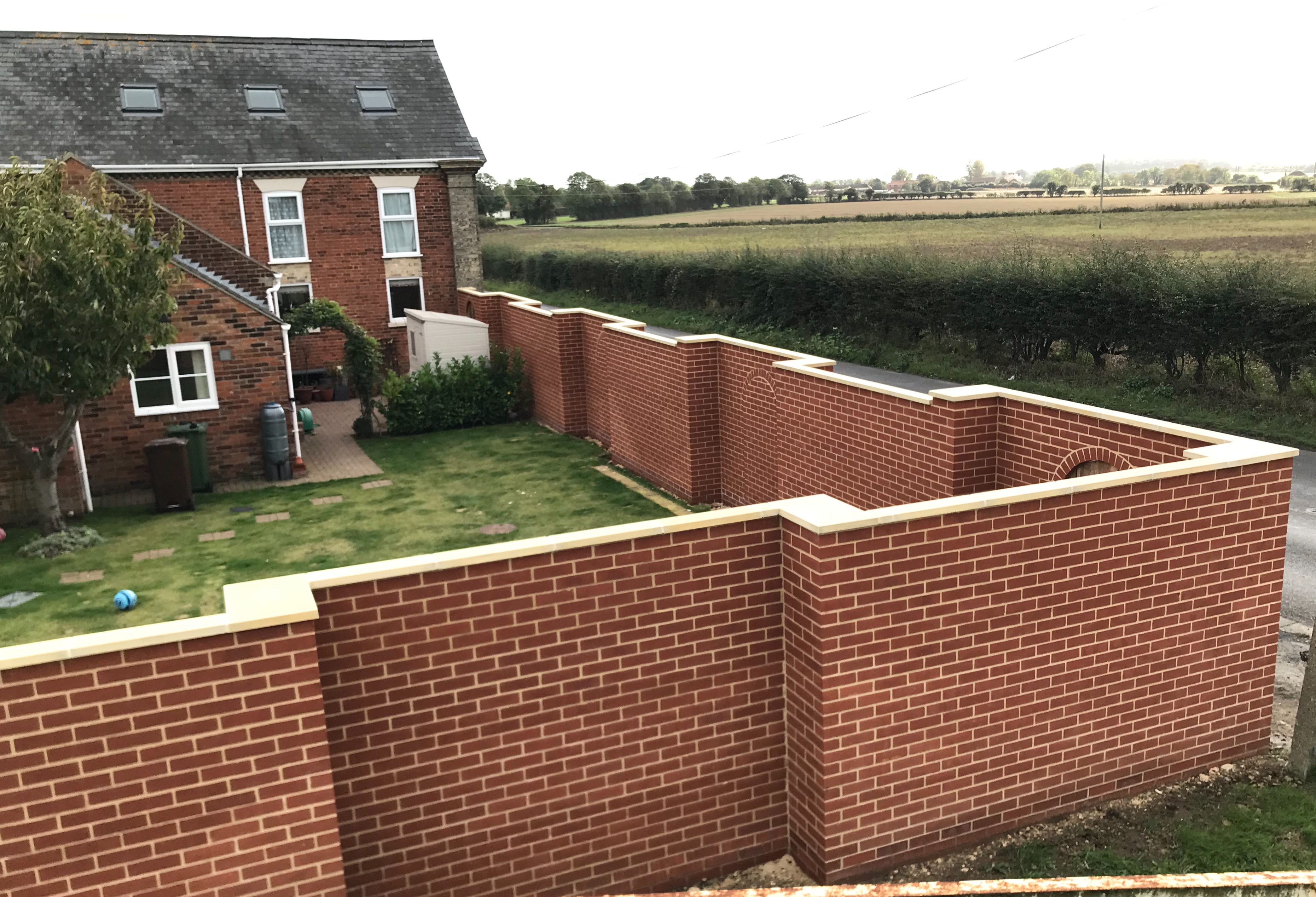 Large stepped Garden walls with Arched Gateways